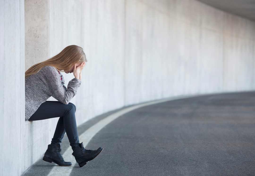 achieving goals, a woman with her head in her hands