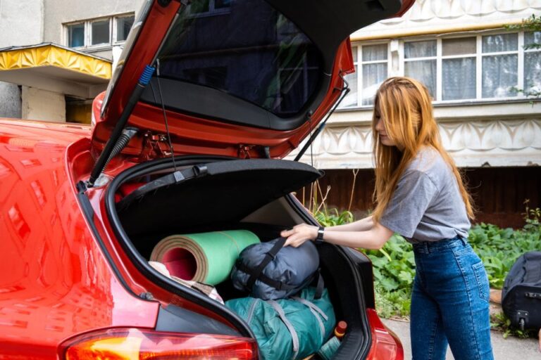empty nest syndrome depression, a girl packing her car to move to college