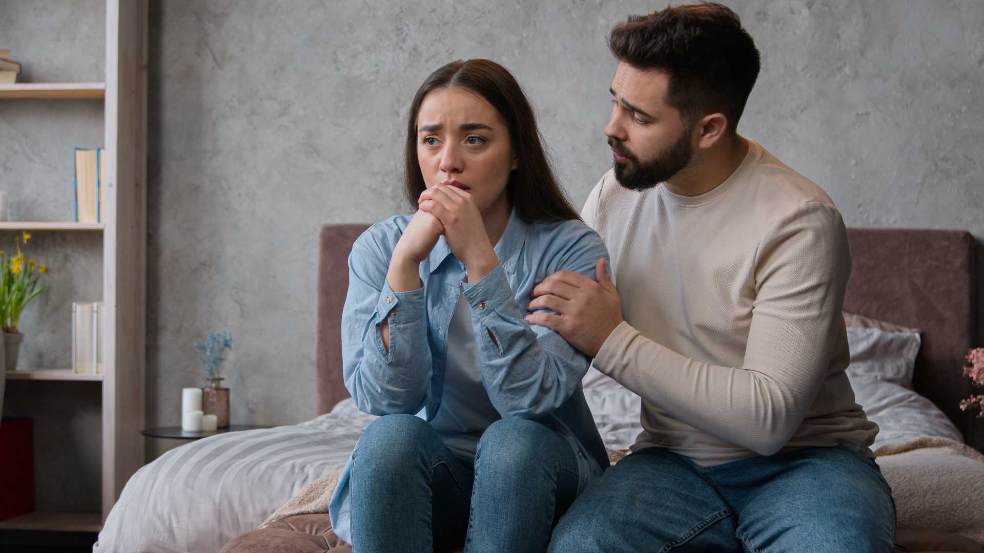 penetration pain in women, A worried woman being comforted by a man