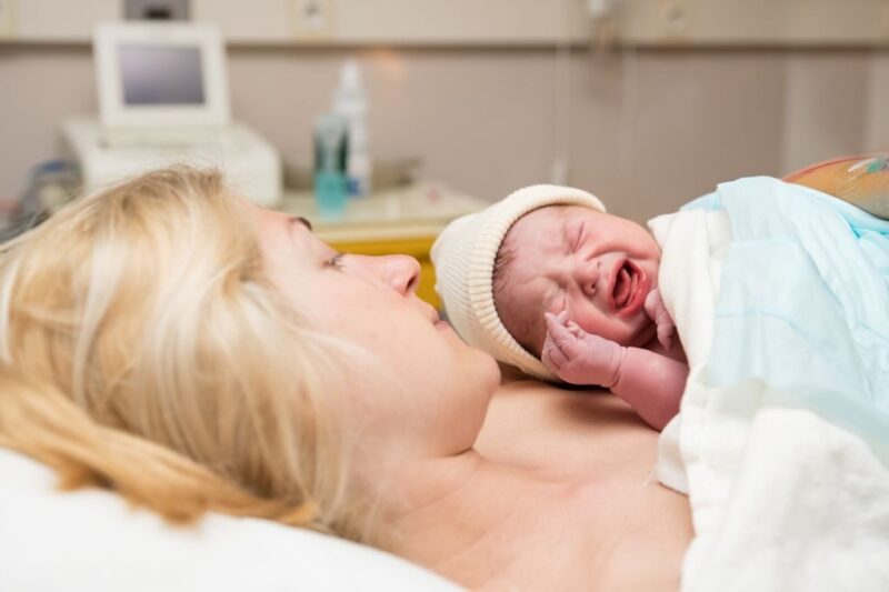 postpartum depression in women, a new mother sharing skin-to-skin contact with her child