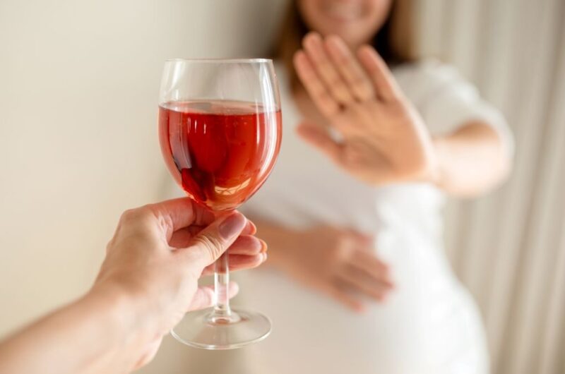 say no to alcohol, woman refusing a drink