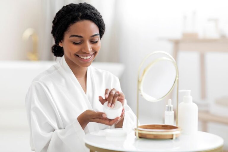 stress skin breakout, woman applying face cream